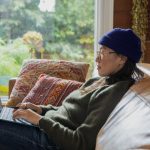 A woman working on business decisions on her laptop