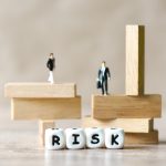 Risk business and SME concept, business man stands on wooden blocks. risk control and managment idea