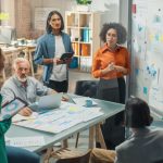 Multiethnic Business Team Discussing Strategy and market in a Meeting Room at the Office