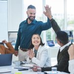 Business team celebrating success. Leader with Emotional intelligence