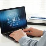 man using computer with antivirus