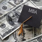 Minil MBA graduation cap on assorted cash -Masters of Business Administration programs