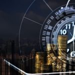 Double exposure of coin stack and alarm clock with city background and financial graph, business finance